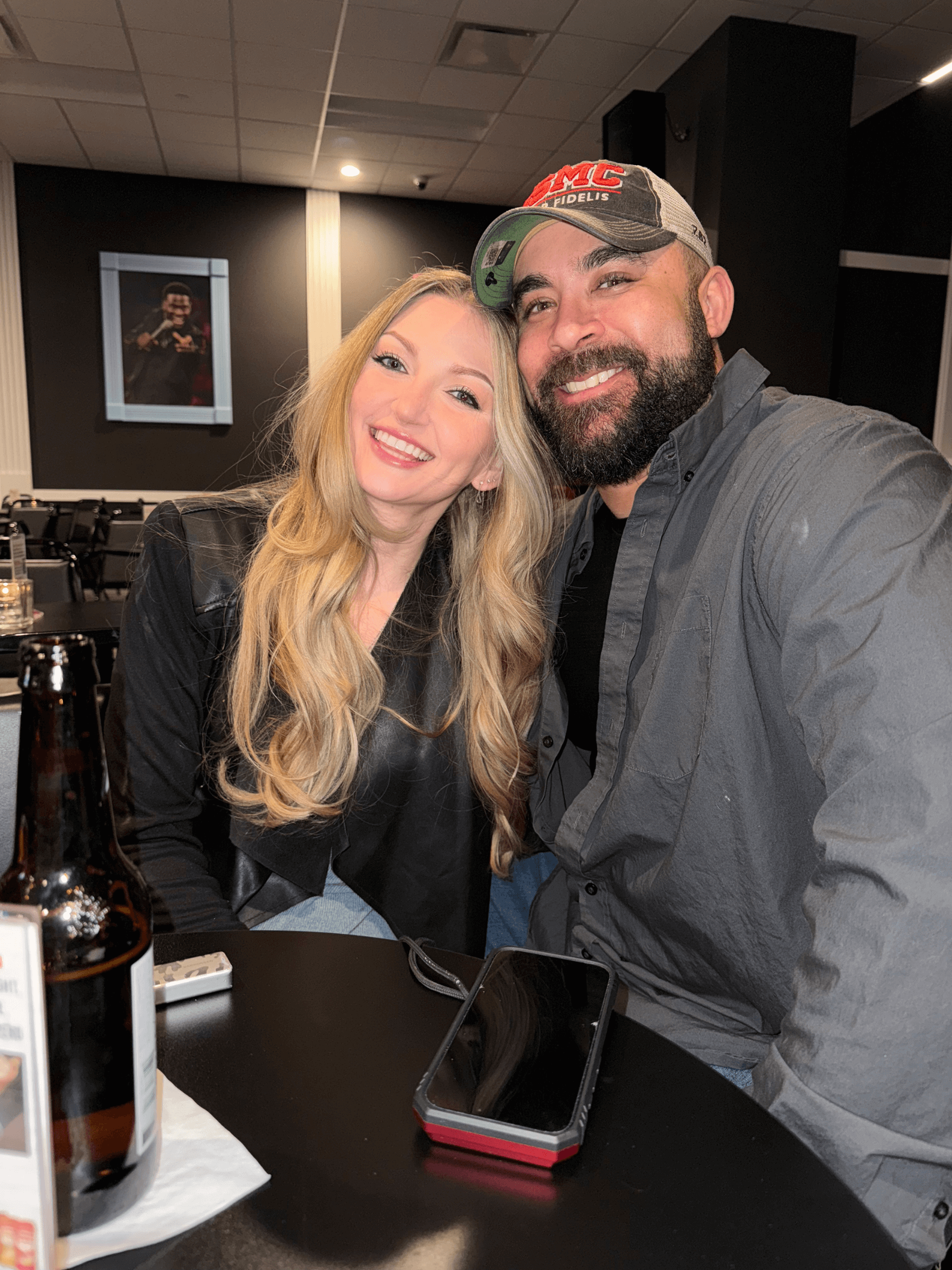 Nick & Allison posing for a photo at dinner