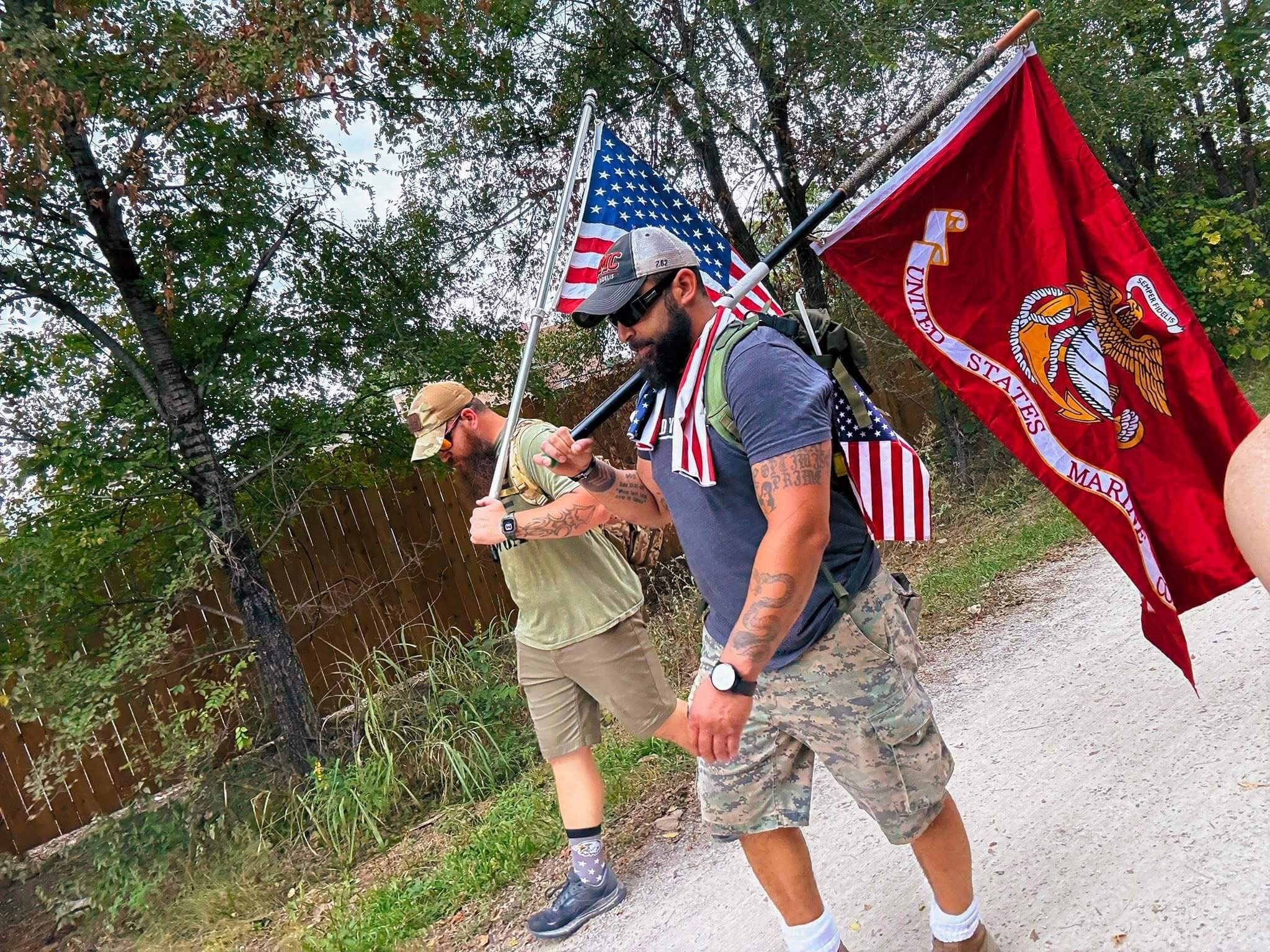Nick walking with the American Flag